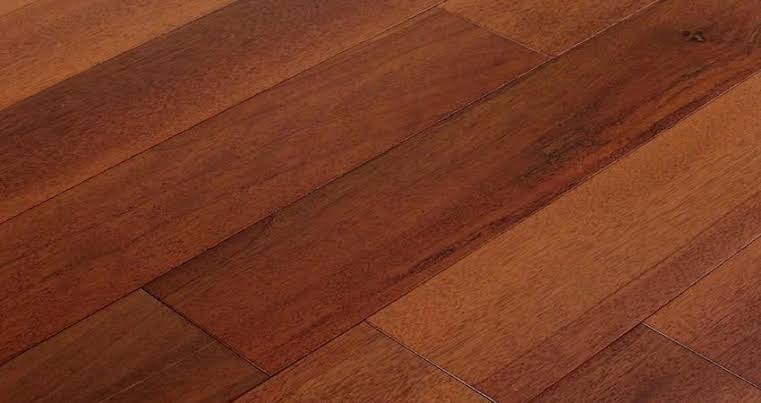Diagonal view of rich reddish-brown Merbau hardwood flooring planks.